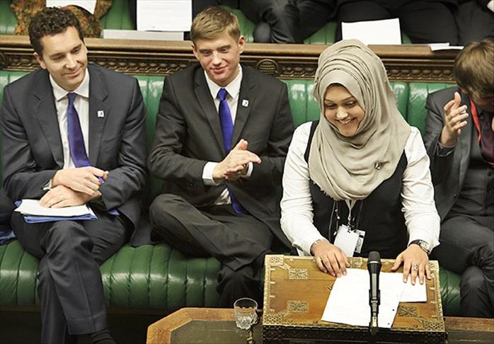 A woman with headscarf talks in British Parliament for first time