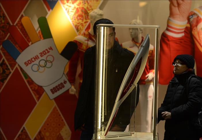 Witnesses to half a century of Games: Moscow hosts Winter Olympics torches