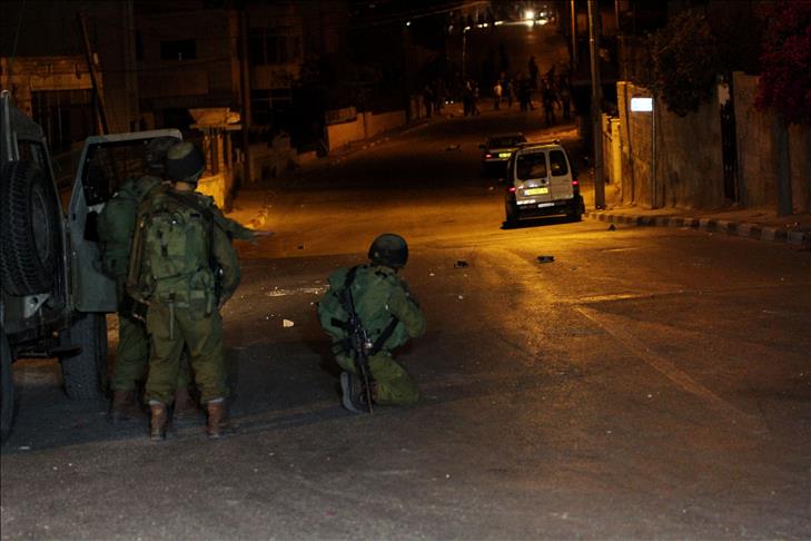 Israeli soldiers, armed men clash south of Gaza