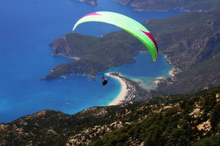 Paragliders color Turkey's western sky