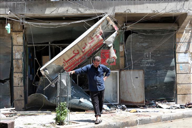 Syrian government forces kill 17 in market attack