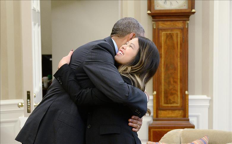 Ebola-free nurse receives hug from US president