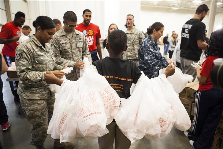 Pro basketball players, US army feed needy children