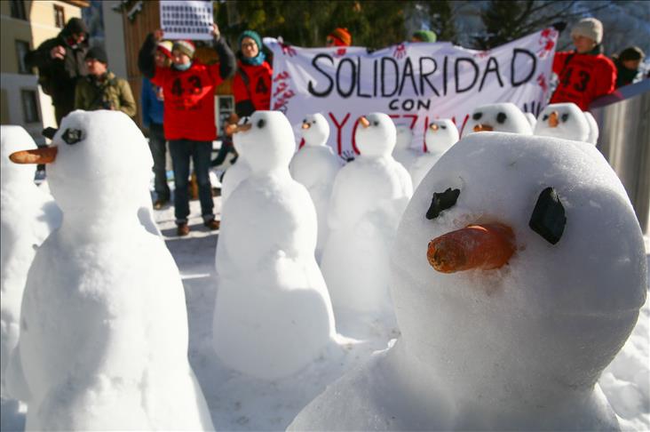 Anti-global activists protest Davos forum with snowmen