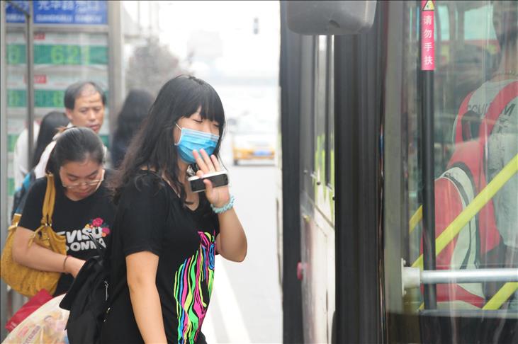Hongkongers don face masks as flu death toll rises
