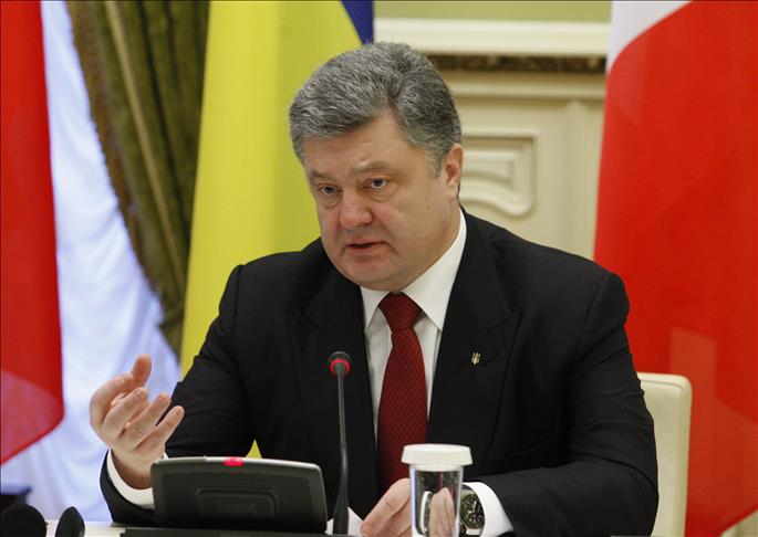 Ukrainian president confirms rebels withdrew heavy arms