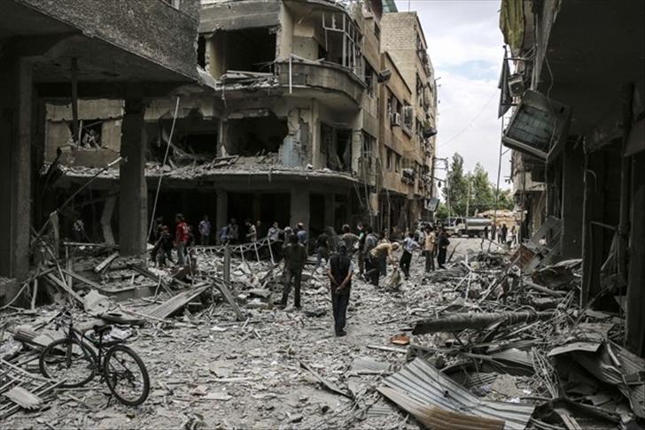 Barrel bombs kill 14 in eastern Syria