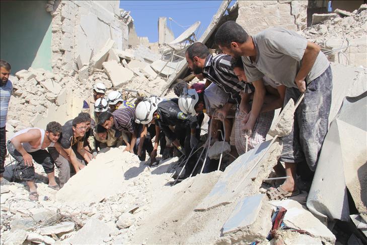 Regime barrel bombs kill 14 in northern Syria