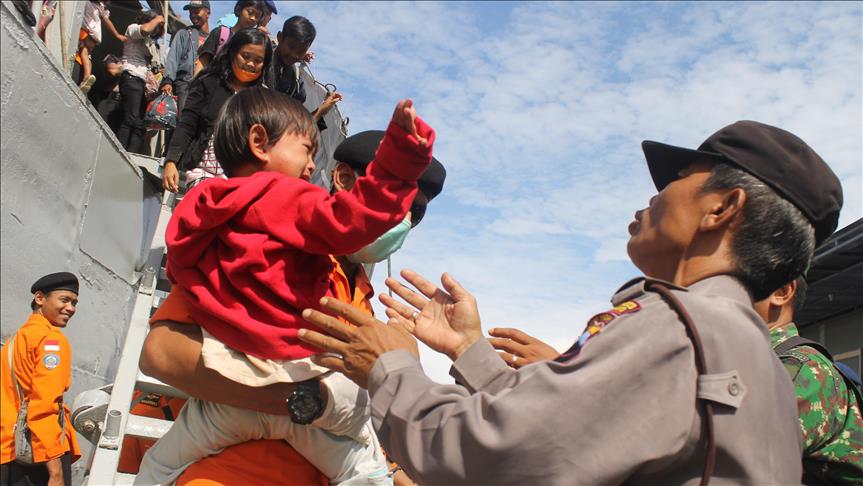 Members of controversial Indonesian community return home