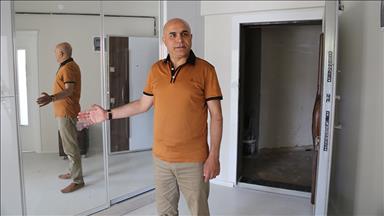 Erzurum'da iki şehidin ailelerine ev hediye edildi