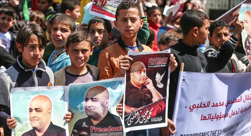 Gazans rally in solidarity with jailed charity employee