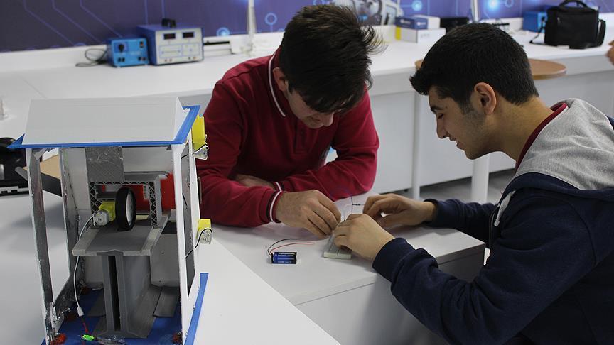 High school students develop money cleaning device