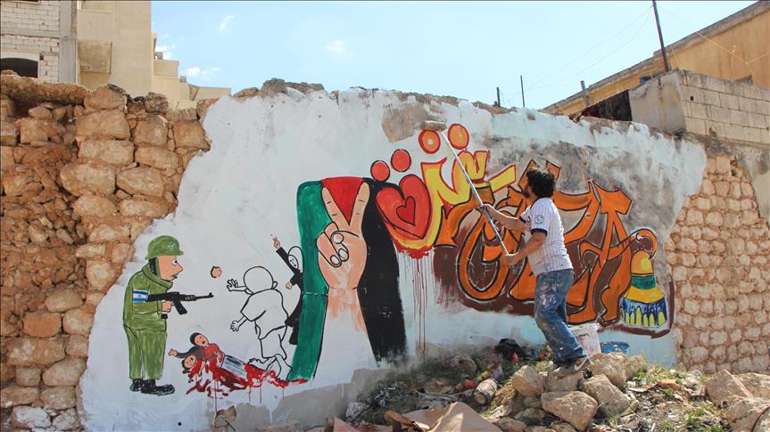 Graffiti artist in Syria’s Idlib shows support for Gaza