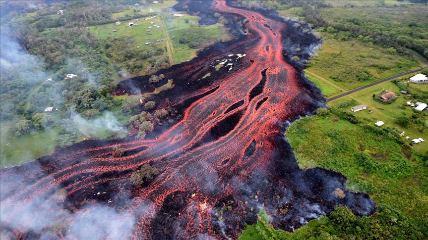 Blue Flames Emerge Between Road Cracks During Kilauea Volcano Eruption