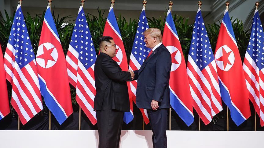 Trump and Kim open historic summit with handshake