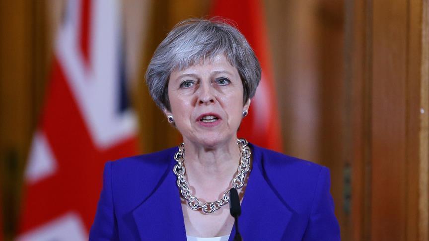 Uk Premier May Downgrades Brexit Department