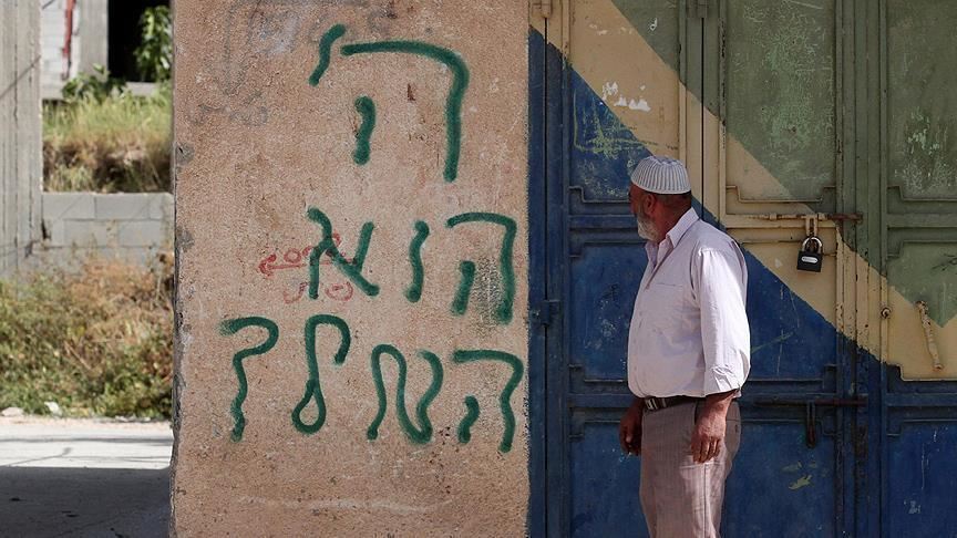 Israeli settlers deface Palestinian homes in West Bank