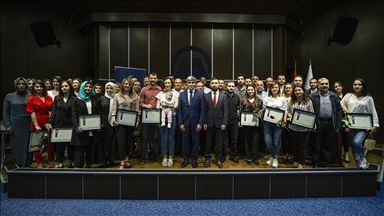 AA'da 5'inci görev yılını dolduran personel için sertifika töreni