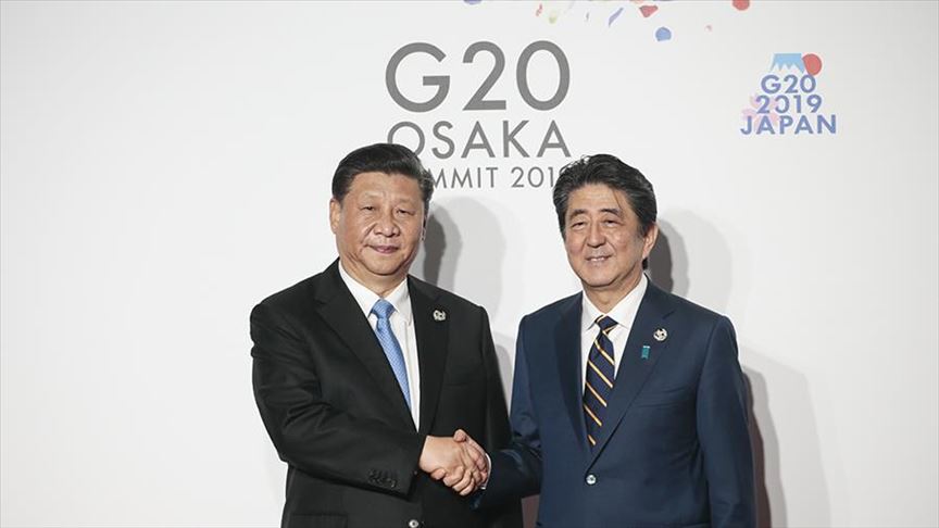 Abe, Xi vow to open 'new era' on bilateral ties