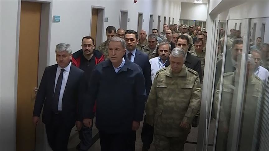 Turkish defense head sees troops hurt in Assad attack