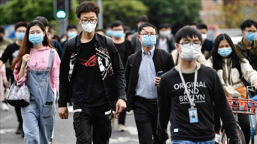 China reports 99 new virus cases, majority imported