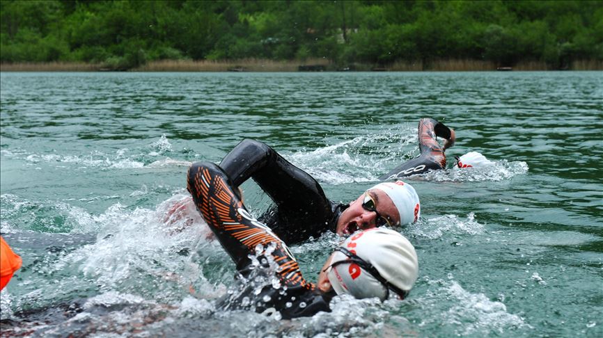 Bosnian swimmers train in glacial lake as pools close