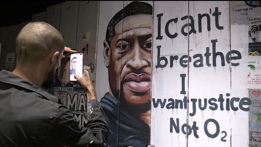 "لا للعنصرية".. رسم لفلويد على الجدار الفاصل بالضفة‎