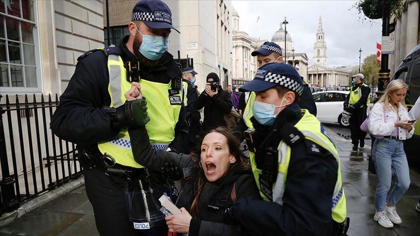 UK: Virus cases climb as protesters march in London
