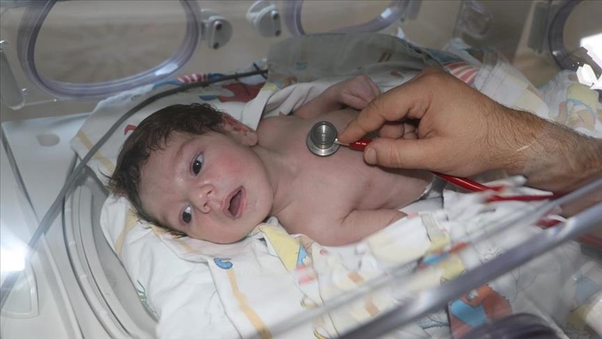Syrian infant in Turkey clutches onto life