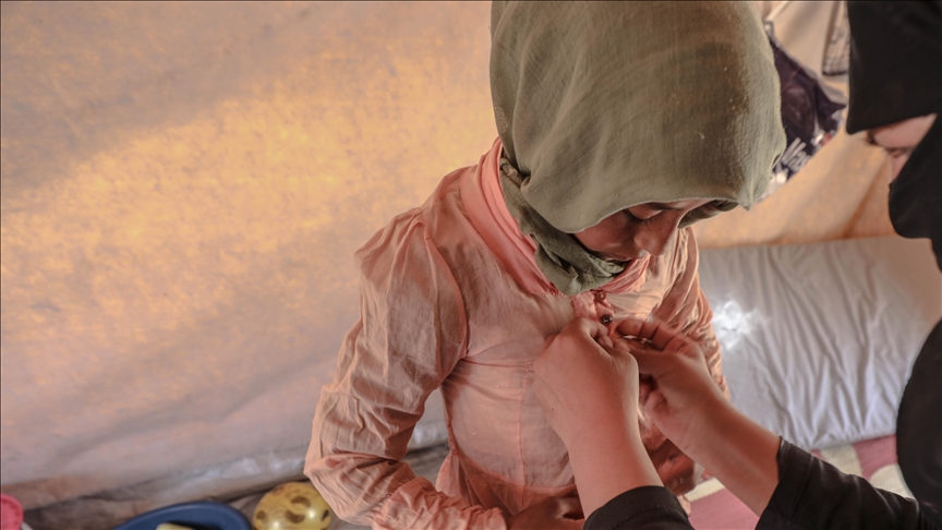 Turkish tailors drape Eid clothing for Syrian children in Idlib