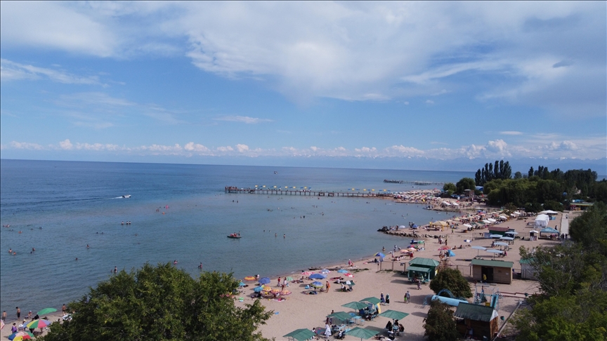 Warm water of Kyrgyzstan's Issyk-Kul lake captivates tourists