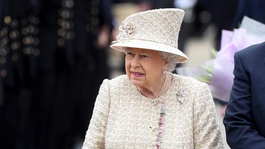 Queen 'back at her desk' after overnight hospital stay: UK prime minister