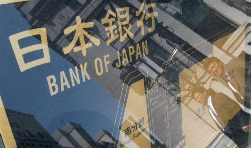 Bank of Japan keeps interest rates steady, cuts inflation and growth forecasts for 2021