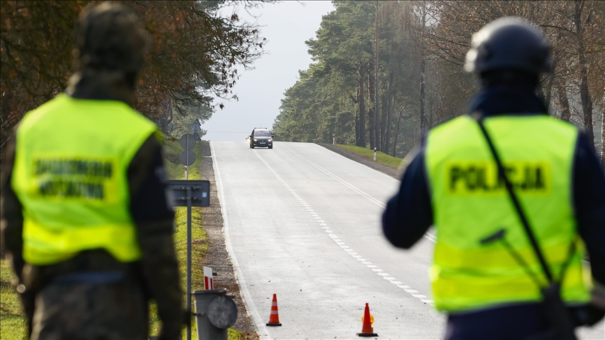 Poland detains 100 migrants after they cross Belarus border
