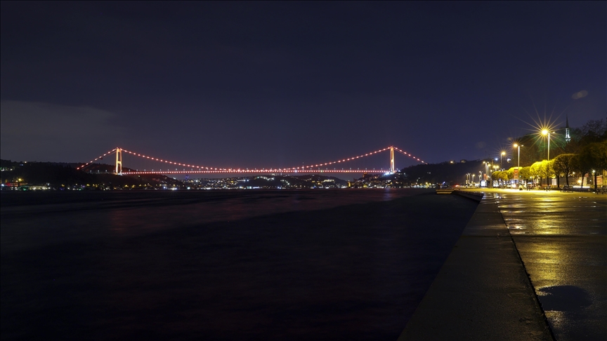 Istanbul's Fatih Sultan Mehmet bridge illuminated in orange in support of ending violence against women