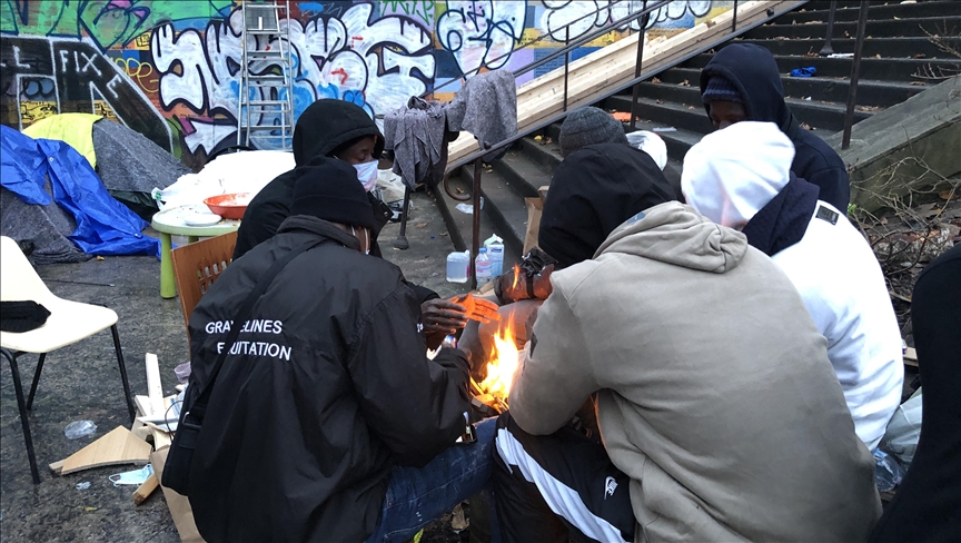 Migrants struggle to survive under bridge in Paris