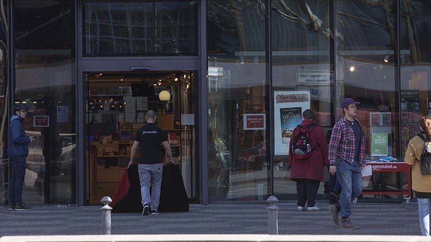 Germany tightens COVID-19 rules to curb omicron