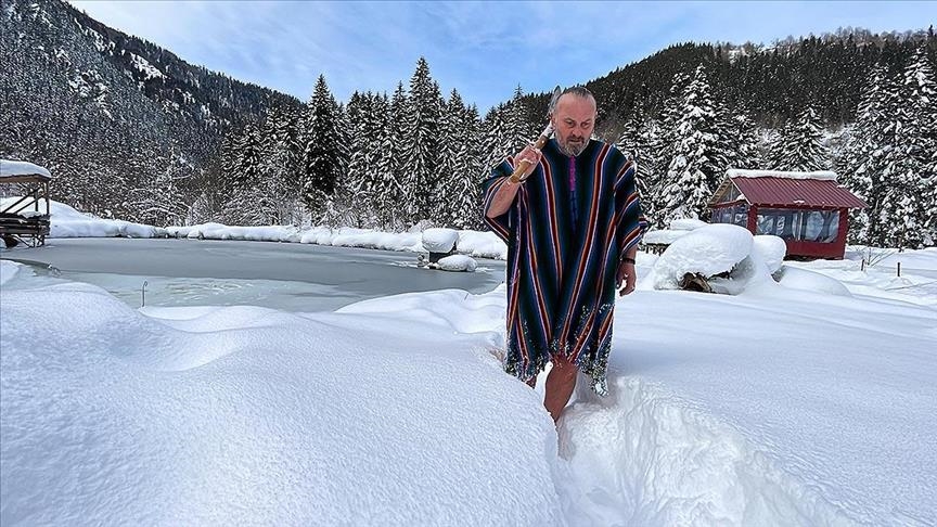 ‘Turkish Viking’ swims in frozen lake, breaks ice with his axe