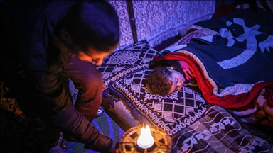 Syrian fathers keep night watch so children don't freeze to death