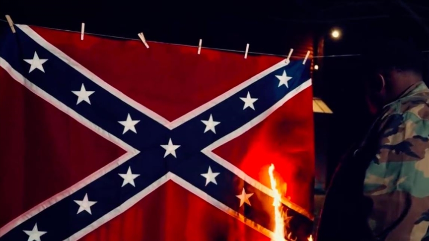 US Senate candidate in Louisiana burns Confederate flag in political ad
