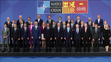 Türkiye's president attends family photo shoot at NATO summit