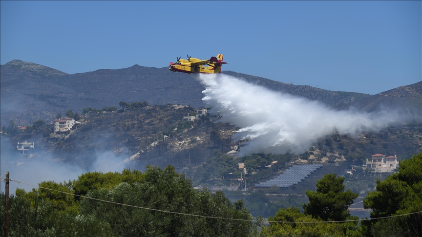 Wildfires sweep through Greece, destroy homes