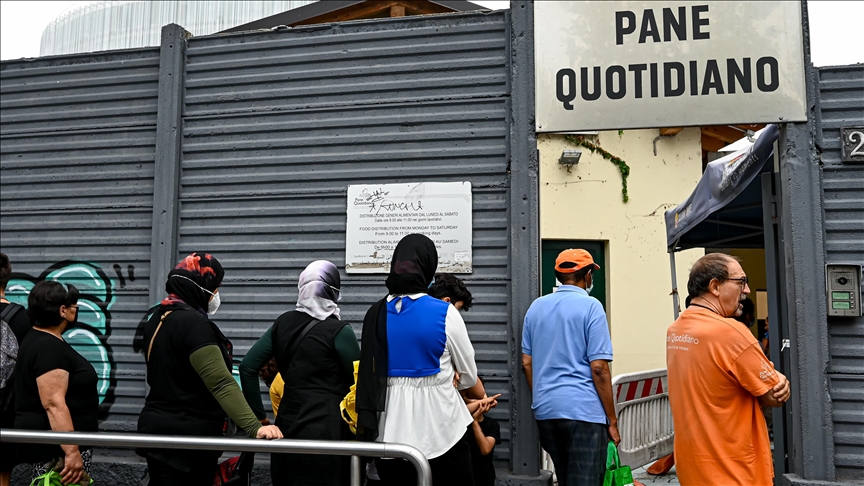 Low income residents queue up in morning to receive basic food bag in Italy