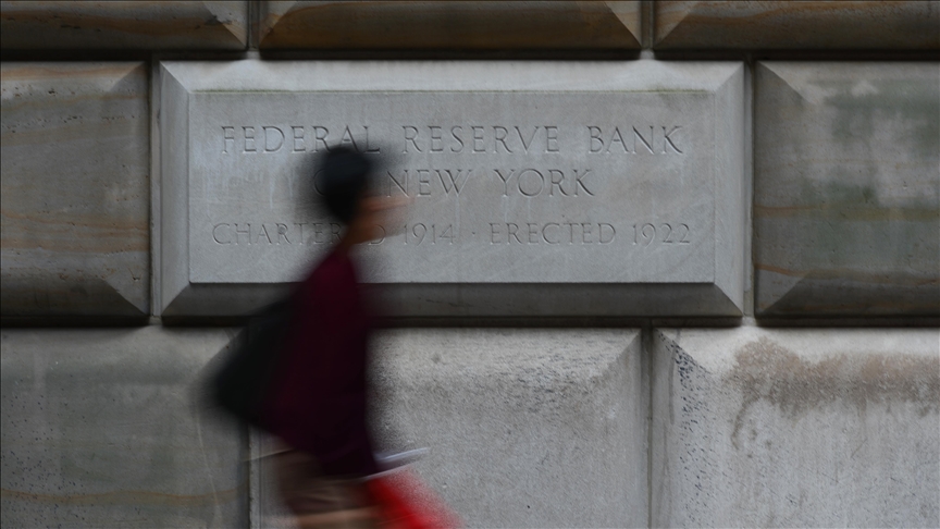 US Fed lowers economic growth forecast, raises terminal rate above 4%