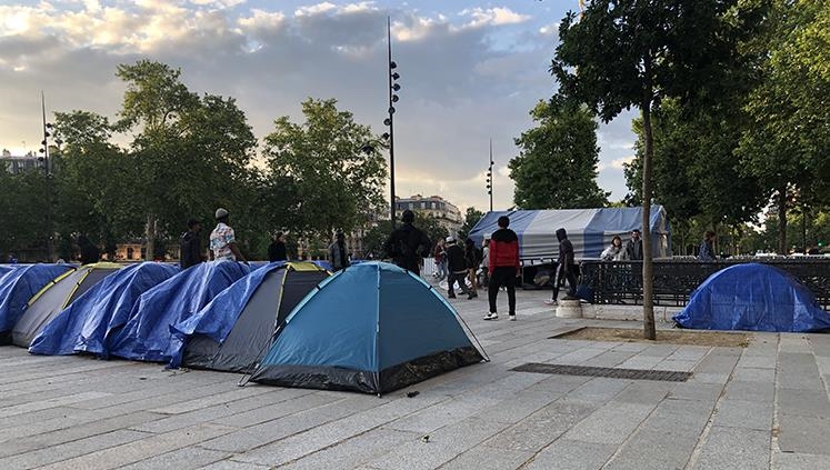 After desperate journeys to France, cold, rain bear down on child migrants