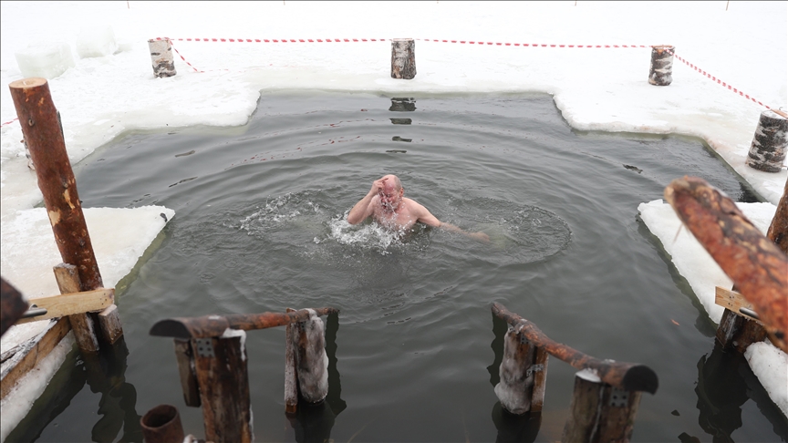 Russians take traditional Epiphany dips in freezing waters