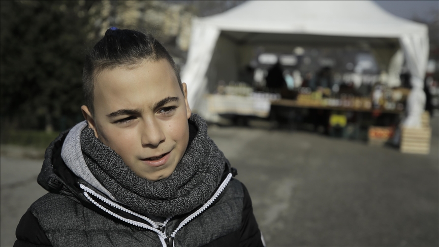 Bosnian boy in Sarajevo, 12, sells tea to help earthquake victims