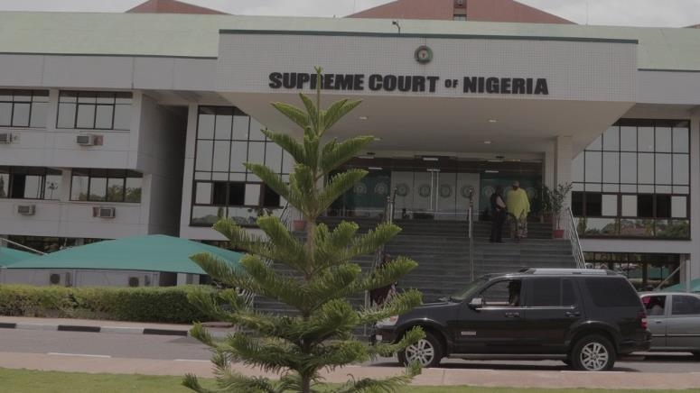 Nigeria’s top court rules old currency notes still legal tender amid cash shortage