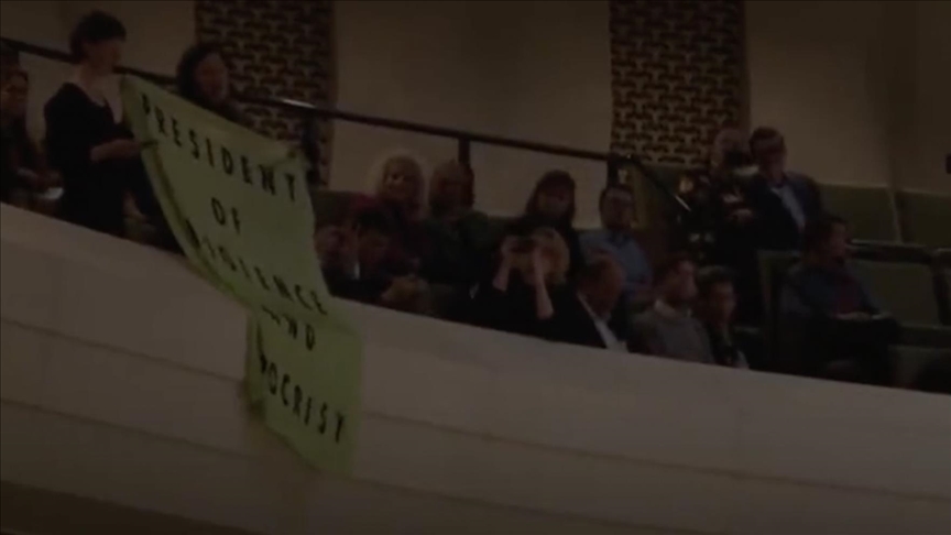 Man protests French pension reform during Macron's Amsterdam visit