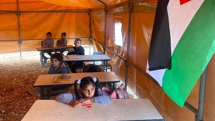 Palestinian students learn in tents after school demolished by Israel